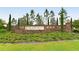 Milano community entrance sign with lush landscaping, creating a welcoming atmosphere at 229 Alento Ct, Nokomis, FL 34275