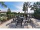 A community fire pit with lounge seating and palm trees at 229 Alento Ct, Nokomis, FL 34275