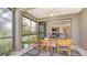 Charming screened lanai with seamless access to the interior, providing comfortable outdoor living and dining at 229 Alento Ct, Nokomis, FL 34275