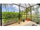 Spacious screened lanai with potted plants, offering a serene and private outdoor living space at 229 Alento Ct, Nokomis, FL 34275