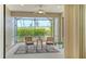 Relaxing screened lanai with outdoor seating and a view of lush landscaping, perfect for enjoying the outdoors at 229 Alento Ct, Nokomis, FL 34275