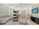 Cozy living room with neutral furniture and view to patio at 229 Alento Ct, Nokomis, FL 34275