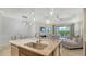 Open-concept living area featuring kitchen, dining area and living room at 229 Alento Ct, Nokomis, FL 34275