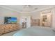 Bright main bedroom with a large dresser and a view into the en suite bathroom at 229 Alento Ct, Nokomis, FL 34275