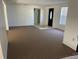 Inviting living room featuring neutral paint, carpet and tile entry at 236 Davis Blvd, Sarasota, FL 34237