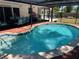 Inviting in-ground pool with brick paver surround and screened lanai, perfect for outdoor relaxation and entertaining at 236 Davis Blvd, Sarasota, FL 34237