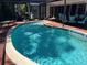 Relaxing in-ground pool with a brick paver surround, ideal for enjoying sunny days and outdoor activities at 236 Davis Blvd, Sarasota, FL 34237