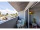 Small, shaded balcony with outdoor seating overlooks a view of a charming coastal community at 2400 N Beach Rd # 1, Englewood, FL 34223