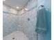 Bathroom showcasing a spacious tiled shower with a built-in seat and modern fixtures at 2400 N Beach Rd # 1, Englewood, FL 34223