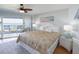 Relaxing bedroom featuring balcony access with lovely ocean views and natural light at 2400 N Beach Rd # 1, Englewood, FL 34223