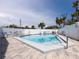 Sparkling community pool surrounded by lounge chairs and lush landscaping, offering a refreshing escape at 2400 N Beach Rd # 1, Englewood, FL 34223