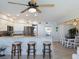 Living area has bar seating with views of the kitchen, laundry area, and dining space at 2400 N Beach Rd # 1, Englewood, FL 34223