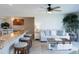 Inviting living room shows the breakfast bar with seating, a sofa, and a coffee table at 2400 N Beach Rd # 1, Englewood, FL 34223