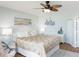 Stylishly decorated main bedroom with a ceiling fan and comfortable Queen bed at 2400 N Beach Rd # 1, Englewood, FL 34223