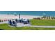 Community patio area overlooking the beach with multiple tables and seating at 2400 N Beach Rd # 1, Englewood, FL 34223