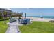 Lovely community patio area with tables and seating, near the beach for residents and guests at 2400 N Beach Rd # 1, Englewood, FL 34223