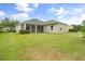 A large, well-maintained backyard featuring a screened-in porch at 2808 124Th E Ave, Parrish, FL 34219