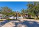 Well-maintained community basketball court next to playground and homes at 2808 124Th E Ave, Parrish, FL 34219
