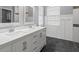 Elegant bathroom featuring double sinks, a modern vanity, and stylish tile work at 2808 124Th E Ave, Parrish, FL 34219