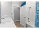 Bathroom featuring stylish white subway tile, shower and bathtub combo, and modern fixtures at 2808 124Th E Ave, Parrish, FL 34219
