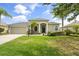 Beautifully landscaped front yard with a well-maintained lawn and charming exterior at 2808 124Th E Ave, Parrish, FL 34219