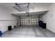 An empty two car garage with lighting and automatic door opener at 2808 124Th E Ave, Parrish, FL 34219