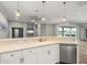 Bright kitchen offers an eat-in bar area, modern lighting, and stainless steel appliances at 2808 124Th E Ave, Parrish, FL 34219