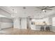Spacious living room and kitchen featuring hardwood floors and modern stainless steel appliances at 2808 124Th E Ave, Parrish, FL 34219