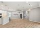 Spacious living room featuring wood floors, a modern ceiling fan, and neutral paint colors at 2808 124Th E Ave, Parrish, FL 34219