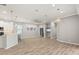 Open-concept living room boasts ample natural light, modern flooring, and stylish fixtures at 2808 124Th E Ave, Parrish, FL 34219