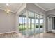 Enclosed patio with glass walls, offering a serene view of the surrounding landscape and natural light at 2808 124Th E Ave, Parrish, FL 34219