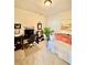 Versatile room with desk, daybed, and soft natural light, perfect for a home office or guest space at 3120 Oriole Dr # 101, Sarasota, FL 34243