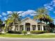 Attractive community clubhouse featuring a welcoming entrance, well-manicured landscaping and sunny skies at 3120 Oriole Dr # 101, Sarasota, FL 34243