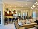 Elegant clubhouse with ample seating, a stylish bar area, and modern decor at 3120 Oriole Dr # 101, Sarasota, FL 34243