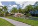 Community entrance sign with water feature and lush landscaping, creating a welcoming atmosphere at 3120 Oriole Dr # 101, Sarasota, FL 34243