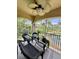 Relaxing screened lanai overlooking a pond features comfortable wicker seating at 3120 Oriole Dr # 101, Sarasota, FL 34243