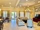 Bright living room featuring stylish furnishings, tile floors, and access to outdoor patio at 3120 Oriole Dr # 101, Sarasota, FL 34243
