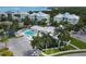 Aerial view of complex with community pool and nearby water views at 3430 77Th W St # 103, Bradenton, FL 34209