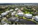 Aerial view of this waterfront complex with a pristine lake and meticulously maintained landscaping at 3430 77Th W St # 103, Bradenton, FL 34209