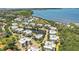 An aerial view showcases waterfront condos surrounded by lush landscaping and beautiful bodies of water at 3430 77Th W St # 103, Bradenton, FL 34209