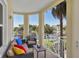 Cozy balcony with comfortable seating and a picturesque lake view at 3430 77Th W St # 103, Bradenton, FL 34209