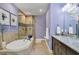 Luxurious bathroom with a soaking tub and a separate glass-enclosed shower at 3430 77Th W St # 103, Bradenton, FL 34209