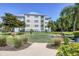Exterior of building complex with putting green and manicured lawns at 3430 77Th W St # 103, Bradenton, FL 34209