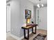 Bright entryway featuring a decorative table with modern lamp and art, adjacent to the front door at 3430 77Th W St # 103, Bradenton, FL 34209