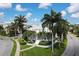Beautiful home with lush landscaping, palm trees and inviting entrance at 3430 77Th W St # 103, Bradenton, FL 34209