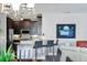 Modern kitchen features stainless steel appliances, granite countertops, and a breakfast bar with seating at 3430 77Th W St # 103, Bradenton, FL 34209