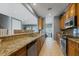 Stylish kitchen with granite countertops, stainless steel appliances, and lots of cabinets at 3430 77Th W St # 103, Bradenton, FL 34209