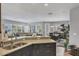 The open-concept kitchen features granite countertops and leads into dining and living spaces at 3430 77Th W St # 103, Bradenton, FL 34209