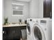 Laundry room area with washer and dryer hookups and ample storage at 3430 77Th W St # 103, Bradenton, FL 34209