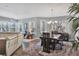 Open-concept living room and dining area with hardwood floors and plenty of natural light at 3430 77Th W St # 103, Bradenton, FL 34209